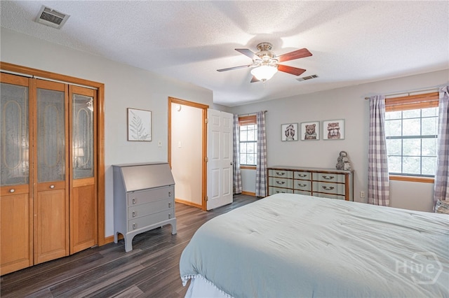 116 Deerfield Dr, Springfield, GA 31329 - bedroom with dark wood-type flooring, baseboards, a textured ceiling, and ceiling fan