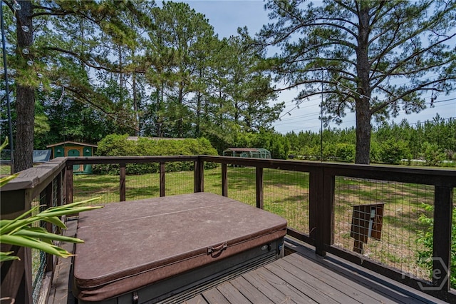 116 Deerfield Dr, Springfield, GA 31329 - wooden deck featuring a storage unit, an outdoor structure, a lawn, a covered hot tub, and view of scattered trees