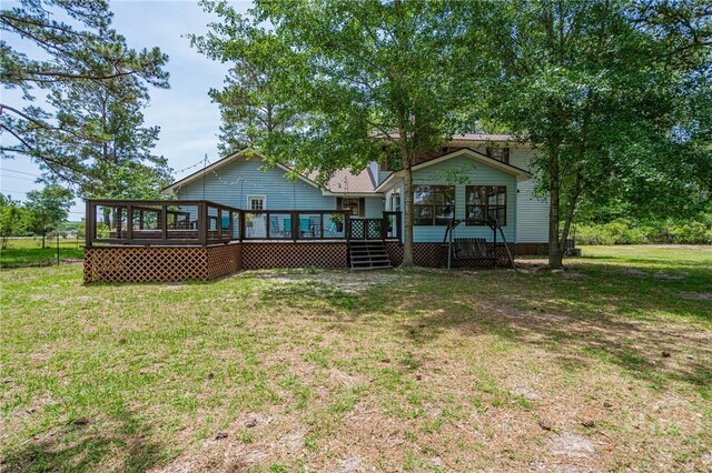 116 Deerfield Dr, Springfield, GA 31329 - back of property featuring a sunroom, a wooden deck, and a lawn