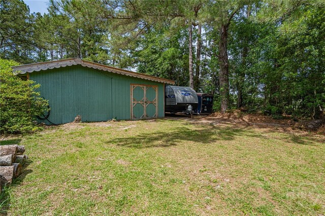 116 Deerfield Dr, Springfield, GA 31329 - view of grassy yard featuring an outdoor structure