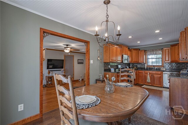 116 Deerfield Dr, Springfield, GA 31329 - dining area with dark wood-type flooring, recessed lighting, a chandelier, ceiling fan, and crown molding