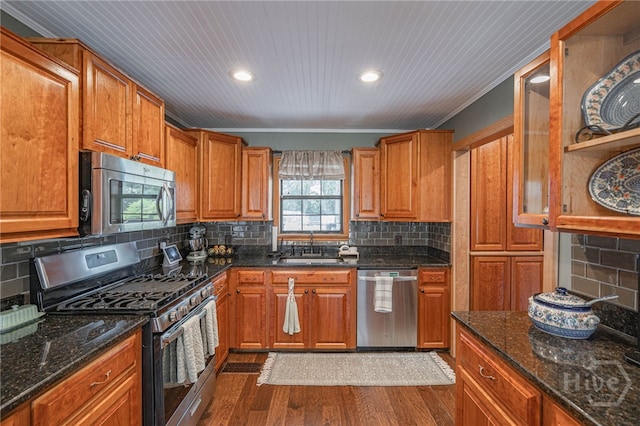 116 Deerfield Dr, Springfield, GA 31329 - kitchen with stainless steel appliances, a sink, brown cabinets, dark wood-style flooring, and recessed lighting