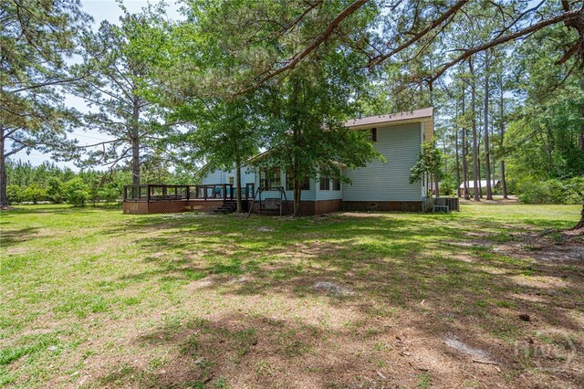 116 Deerfield Dr, Springfield, GA 31329 - view of green lawn featuring a deck