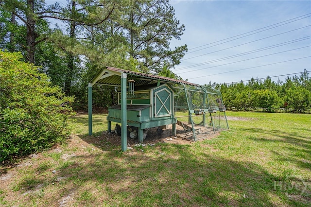 116 Deerfield Dr, Springfield, GA 31329 - view of green lawn with exterior structure and an outbuilding