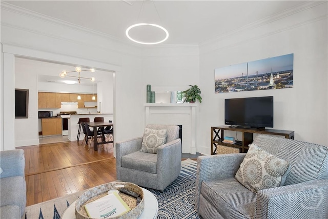 117 Lincoln St Unit 4A, Savannah, GA 31401 - living room featuring hardwood / wood-style flooring, crown molding, a fireplace, and baseboards