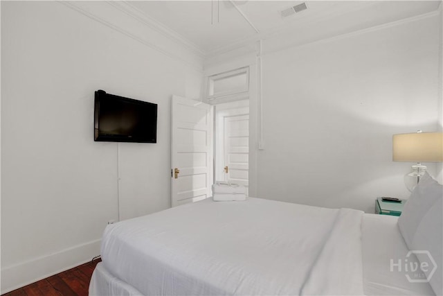 117 Lincoln St Unit 4A, Savannah, GA 31401 - bedroom featuring crown molding, dark wood-style floors, and baseboards
