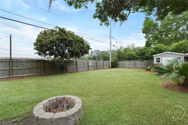 622 Northbrook Rd, Savannah, GA 31419 - view of yard featuring a fire pit, an outbuilding, and a storage unit