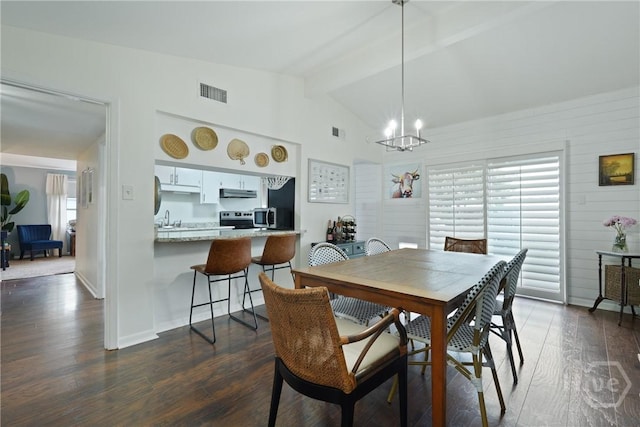622 Northbrook Rd, Savannah, GA 31419 - dining space with dark wood-style flooring and a chandelier
