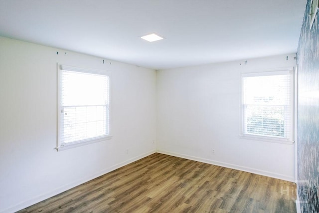 1 Broadmoor Cir, Savannah, GA 31406 - empty room featuring plenty of natural light, wood finished floors, and baseboards