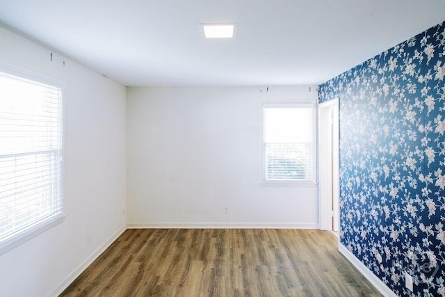 1 Broadmoor Cir, Savannah, GA 31406 - unfurnished room featuring wallpapered walls, wood finished floors, and baseboards