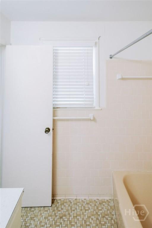 1 Broadmoor Cir, Savannah, GA 31406 - bathroom with a shower, a bath, tile walls, and vanity