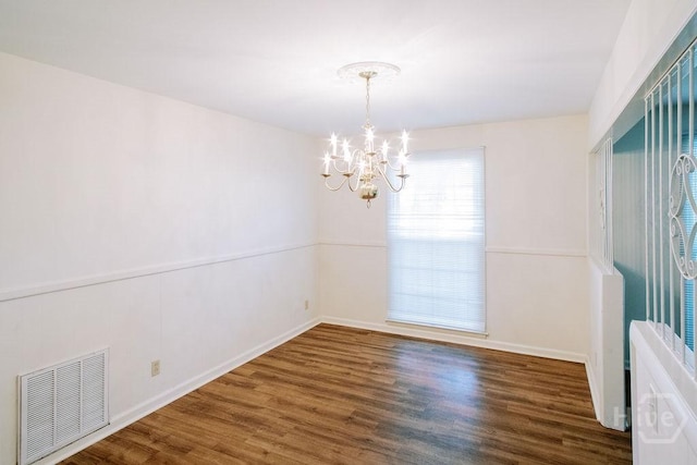 1 Broadmoor Cir, Savannah, GA 31406 - unfurnished room with a chandelier, wood finished floors, and baseboards