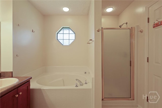 1919 Bluestone Loop, Hinesville, GA 31313 - full bath featuring a bath, a stall shower, vanity, and a textured ceiling