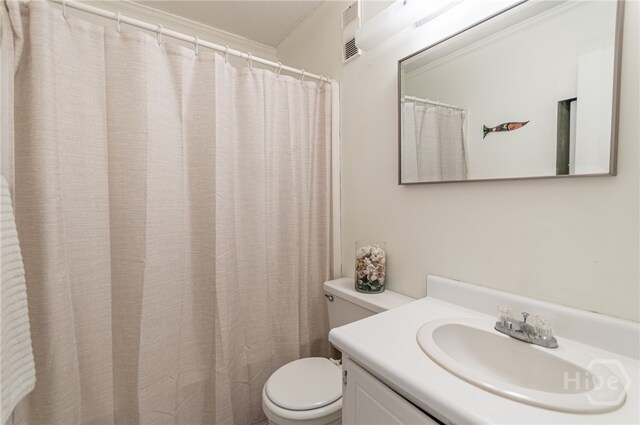1217 Bay St Unit 107B, Tybee Island, GA 31328 - full bath featuring toilet, vanity, and ornamental molding