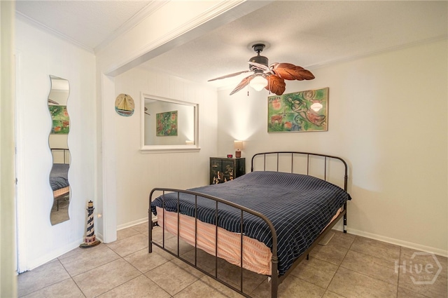 1217 Bay St Unit 107B, Tybee Island, GA 31328 - bedroom featuring ornamental molding, light tile patterned floors, baseboards, and a ceiling fan
