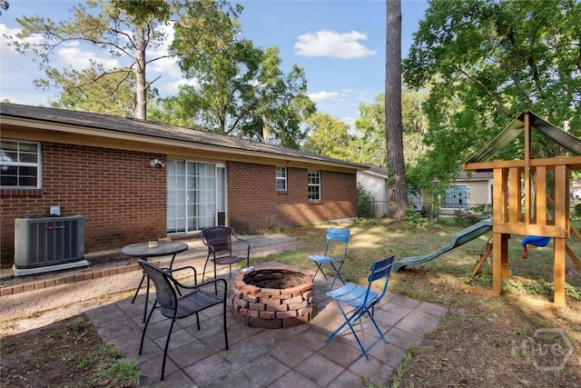 1613 Rosewood Dr, Savannah, GA 31406 - view of patio / terrace featuring central AC unit, an outdoor fire pit, and a playground