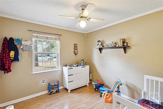 1613 Rosewood Dr, Savannah, GA 31406 - bedroom with light wood-type flooring, ornamental molding, a textured ceiling, ceiling fan, and baseboards