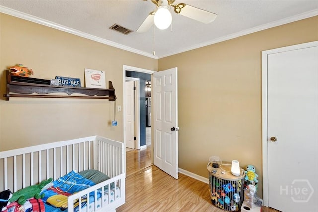1613 Rosewood Dr, Savannah, GA 31406 - bedroom with wood finished floors, ornamental molding, baseboards, and ceiling fan
