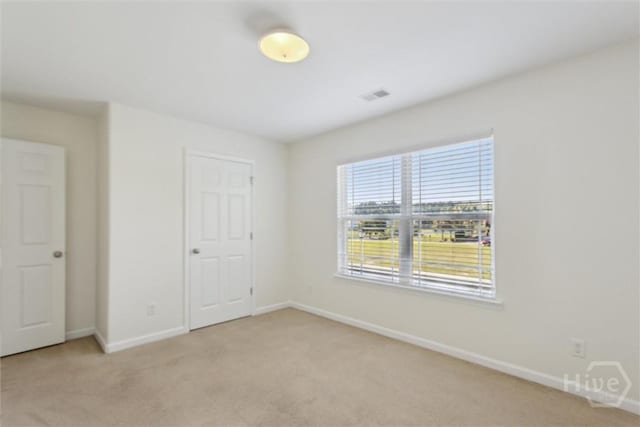 133 Spring Lakes Dr, Savannah, GA 31407 - unfurnished bedroom featuring light colored carpet and baseboards