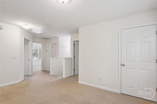 133 Spring Lakes Dr, Savannah, GA 31407 - spare room featuring attic access, light carpet, and baseboards