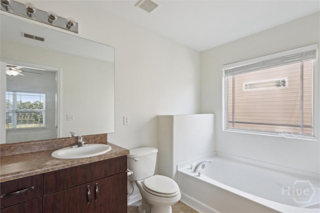 133 Spring Lakes Dr, Savannah, GA 31407 - bathroom featuring a bath, toilet, vanity, and ceiling fan