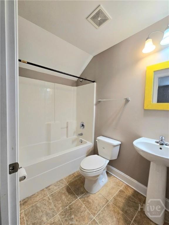 6 Sagefield Dr, Ellabell, GA 31308 - bathroom with toilet, vaulted ceiling, shower / tub combination, and baseboards