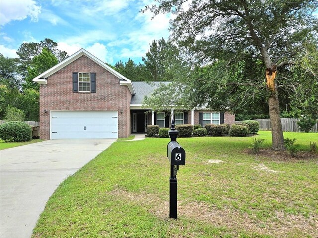 6 Sagefield Dr, Ellabell, GA 31308 - view of front of property with brick siding, an attached garage, and concrete driveway