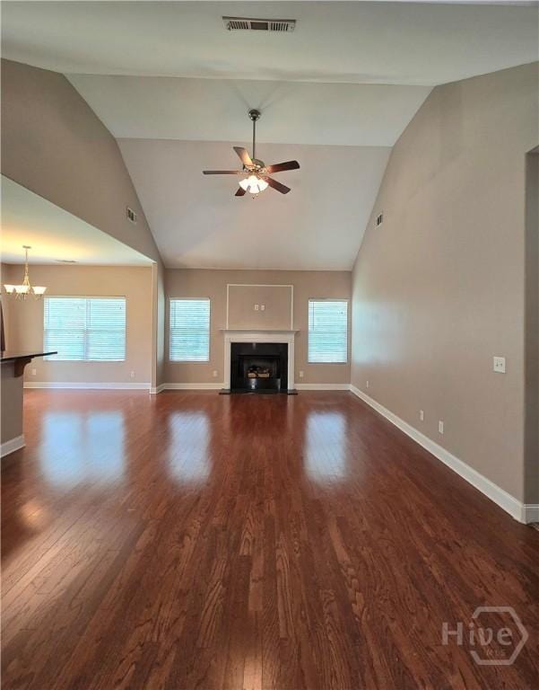 6 Sagefield Dr, Ellabell, GA 31308 - unfurnished living room with ceiling fan, high vaulted ceiling, healthy amount of natural light, baseboards, and a fireplace