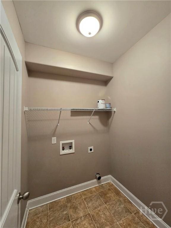 6 Sagefield Dr, Ellabell, GA 31308 - laundry area featuring hookup for a washing machine, electric dryer hookup, baseboards, and stone finish flooring