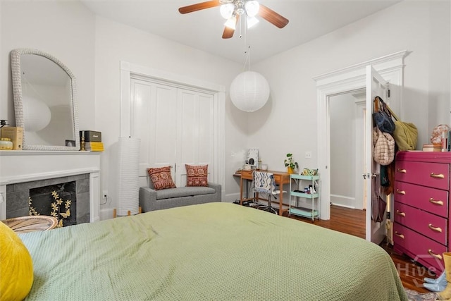 1722/1724 Barnard St, Savannah, GA 31401 - bedroom with wood finished floors, a fireplace, and ceiling fan