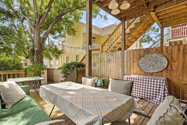 1722/1724 Barnard St, Savannah, GA 31401 - deck with outdoor dining area, stairs, and ceiling fan