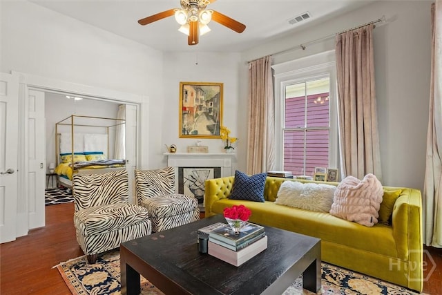 1722/1724 Barnard St, Savannah, GA 31401 - living room with a ceiling fan, wood finished floors, and a fireplace