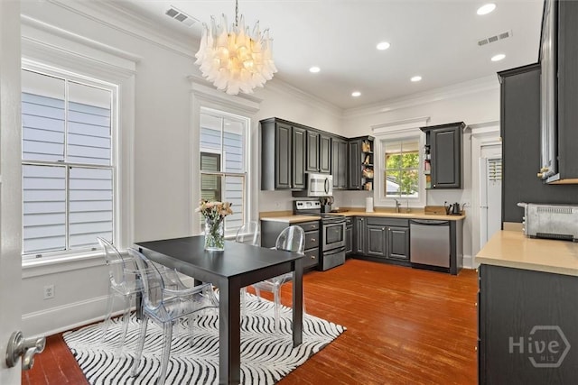 1722/1724 Barnard St, Savannah, GA 31401 - kitchen with stainless steel appliances, ornamental molding, dark wood finished floors, light countertops, and open shelves