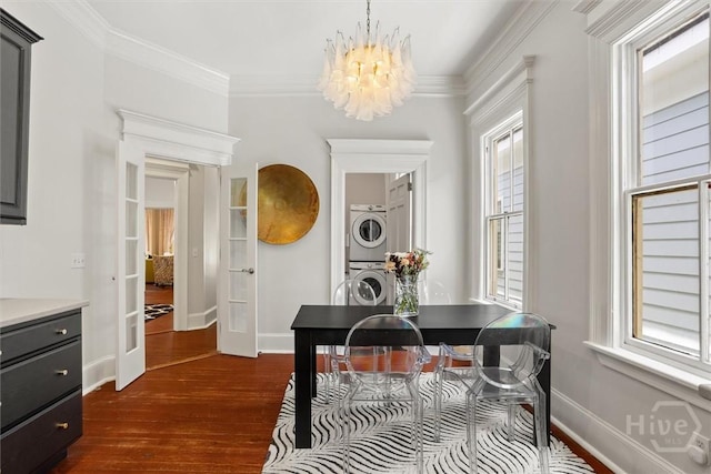 1722/1724 Barnard St, Savannah, GA 31401 - dining room with stacked washing machine and dryer, french doors, dark wood-style floors, baseboards, and a chandelier
