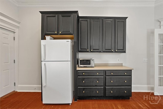 1722/1724 Barnard St, Savannah, GA 31401 - kitchen featuring freestanding refrigerator, baseboards, dark wood-style floors, and ornamental molding