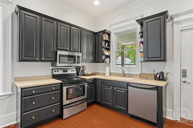 1722/1724 Barnard St, Savannah, GA 31401 - kitchen featuring stainless steel appliances, a sink, wood finished floors, light countertops, and open shelves
