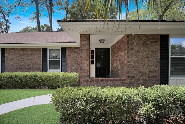 1 Black Forest Dr, Savannah, GA 31410 - view of exterior entry featuring brick siding and a lawn