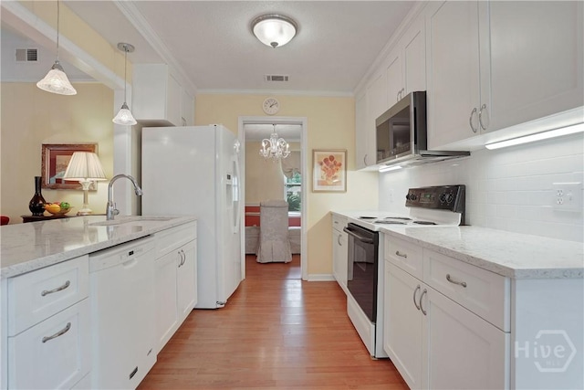 1 Black Forest Dr, Savannah, GA 31410 - kitchen featuring white appliances, a sink, light wood finished floors, white cabinetry, and crown molding