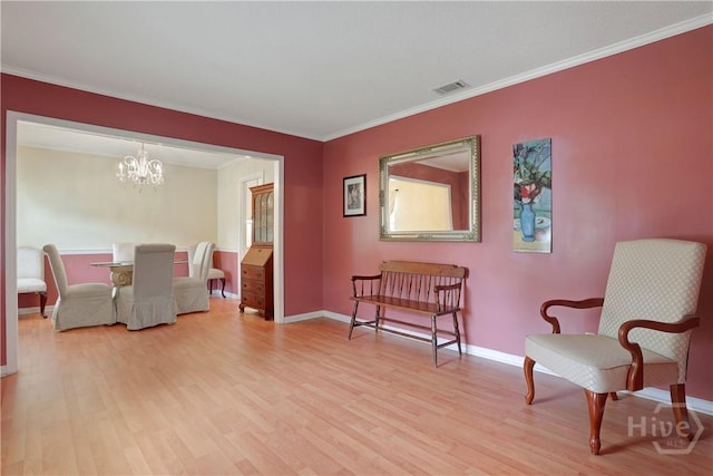1 Black Forest Dr, Savannah, GA 31410 - sitting room featuring light wood-type flooring, a chandelier, baseboards, and crown molding