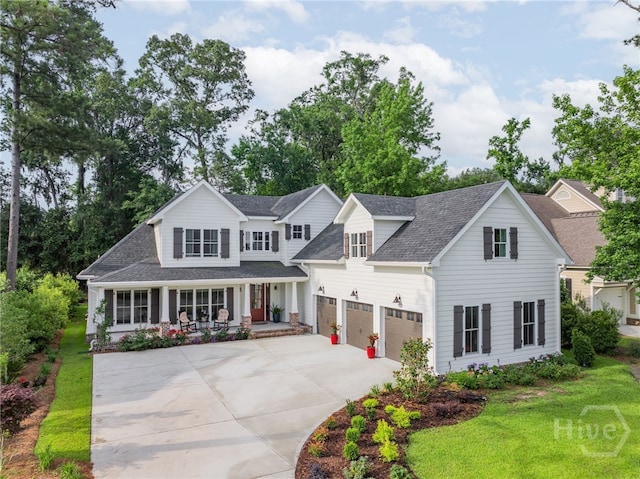 124 Kent Trl, Pooler, GA 31322 - view of front of home featuring a porch, concrete driveway, roof with shingles, a garage, and a front yard