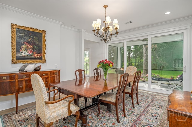 124 Kent Trl, Pooler, GA 31322 - dining area with a chandelier, wood finished floors, and crown molding