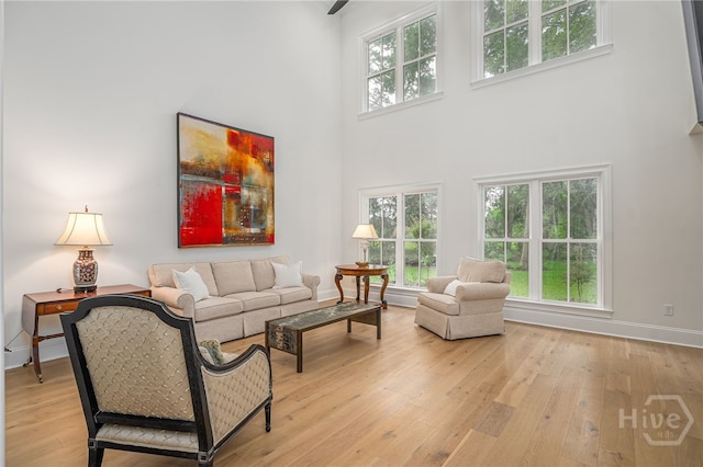 124 Kent Trl, Pooler, GA 31322 - living room with a high ceiling, light wood-style flooring, and baseboards
