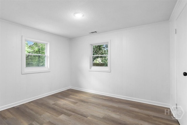 72 Bazemore Ave, Savannah, GA 31408 - empty room featuring dark wood-type flooring, baseboards, and ornamental molding