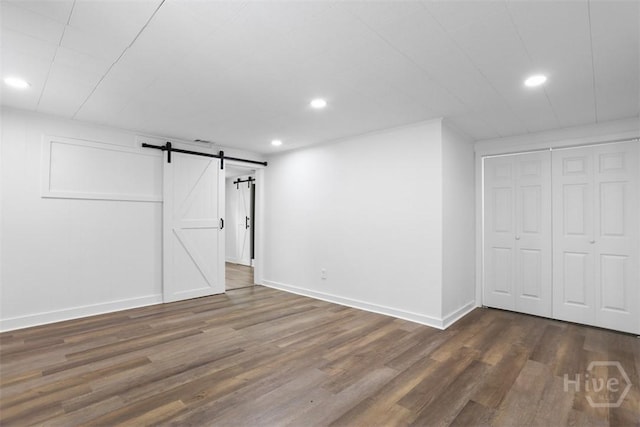 72 Bazemore Ave, Savannah, GA 31408 - below grade area featuring wood finished floors, recessed lighting, baseboards, and a barn door