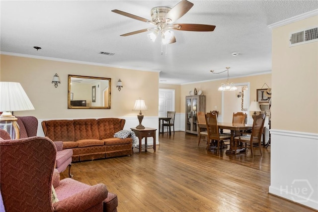2006 Cokesbury Dr, Savannah, GA 31406 - living room with crown molding, a ceiling fan, wood finished floors, and a chandelier