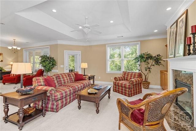204 River Oaks Dr, Richmond Hill, GA 31324 - living room featuring a tray ceiling, a premium fireplace, a ceiling fan, crown molding, and recessed lighting