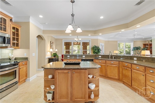 204 River Oaks Dr, Richmond Hill, GA 31324 - kitchen with open shelves, stainless steel appliances, a sink, arched walkways, and a chandelier