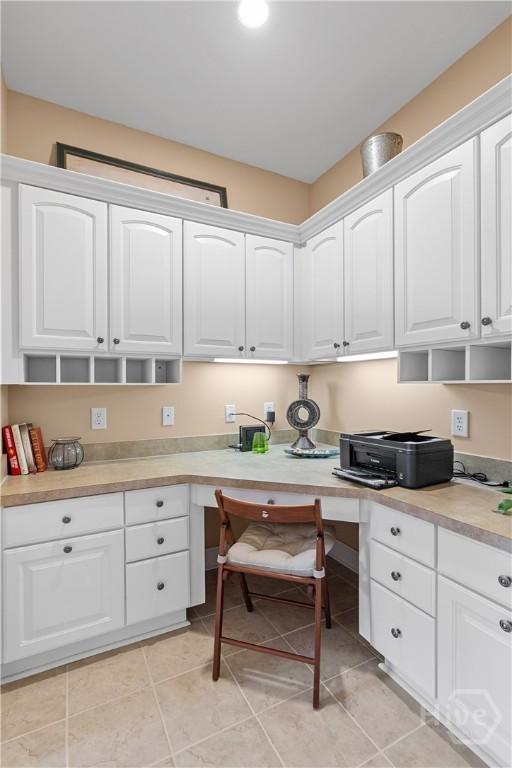 204 River Oaks Dr, Richmond Hill, GA 31324 - office area featuring built in study area and light tile patterned flooring
