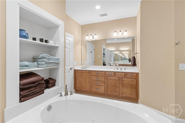 204 River Oaks Dr, Richmond Hill, GA 31324 - bathroom with a whirlpool tub and double vanity