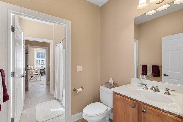 204 River Oaks Dr, Richmond Hill, GA 31324 - bathroom featuring tile patterned floors, vanity, toilet, baseboards, and a shower with curtain
